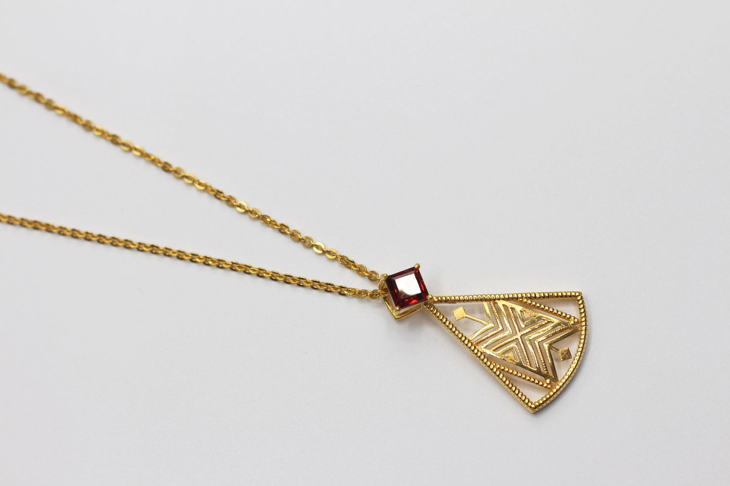 Hayma’a Fattan Pendant with Garnet